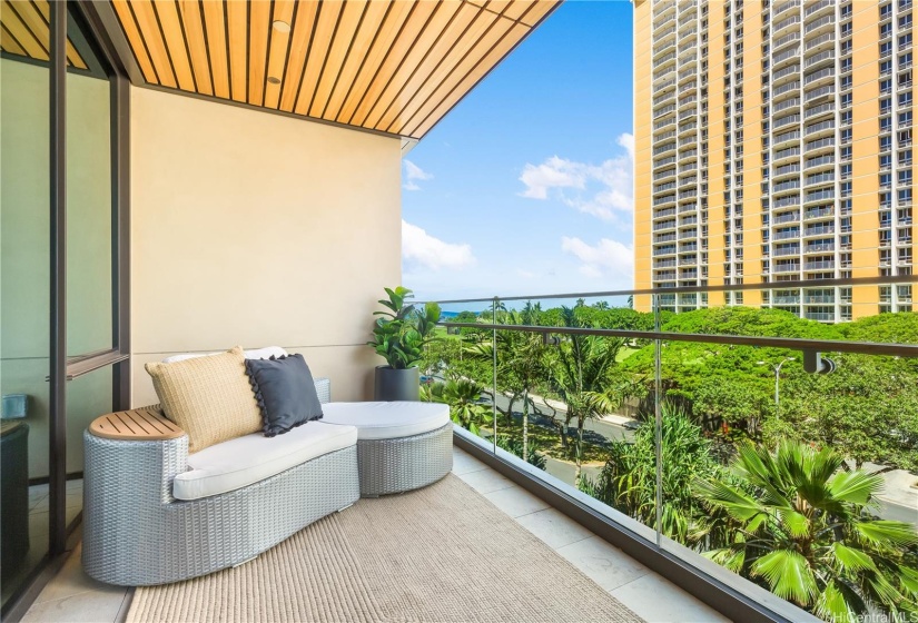 Relax on the lanai where you'll be just above the tree tops with a view towards Ala Moana Beach Park.