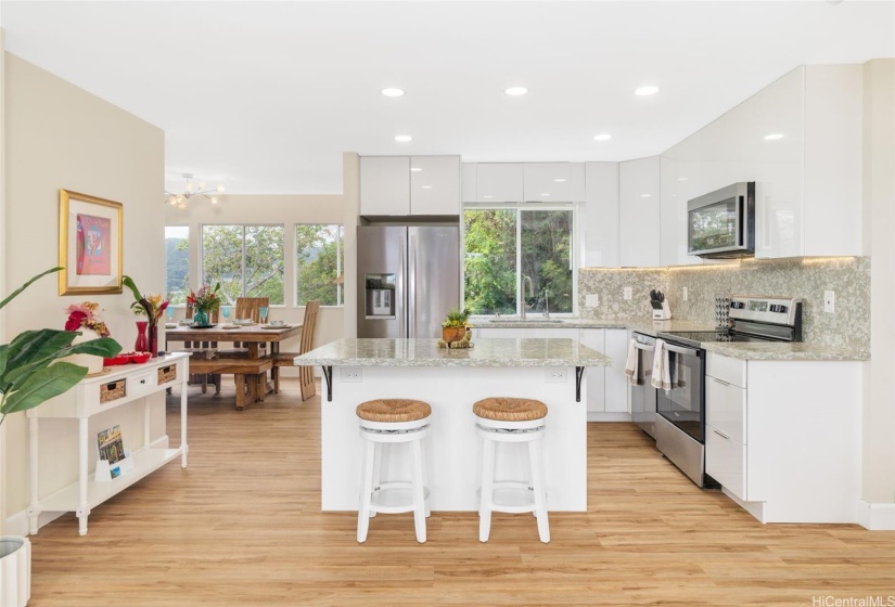 Imagine cooking in your designer kitchen. The calming colors of the walls and new earthy-tone flooring helps to further connect you to nature.