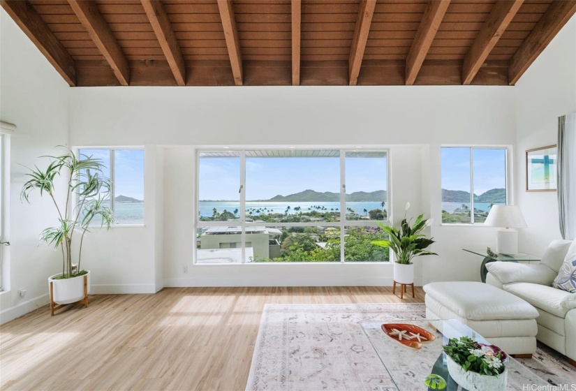 The large windows in the living room facing the ocean provide endless ocean views. The open floor plan maximizes the feeling of being connected to the outdoors and brings the ocean views inside.