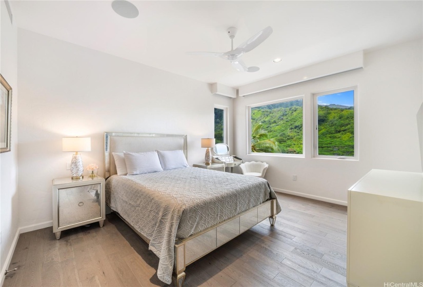 First bedroom on the third floor of the home with beautiful mountain views, ensuite bathroom.