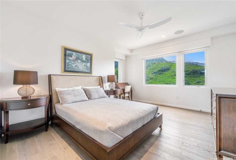 Second bedroom on the third floor of the home with beautiful views of the mountains and ensuite bathroom.