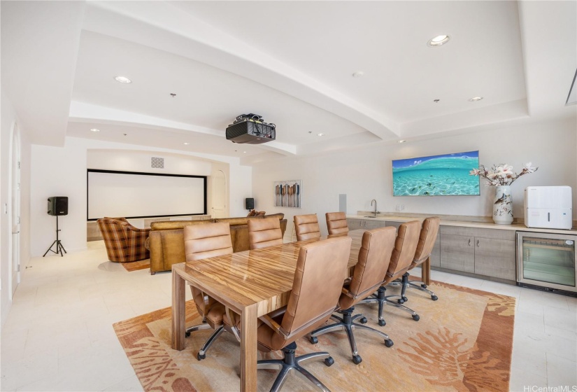 Media and conference room on the first floor of the property.  Room features 140-inch theater system with a high-definition laser projector, wet bar, and room for a conference table, and seating for 8+ people.