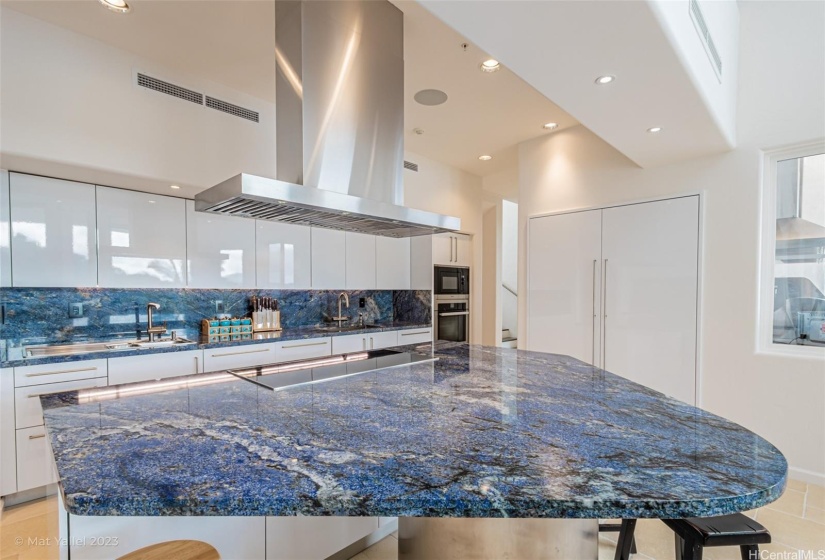 Kitchen features Miele appliances, Blue Bahia marble countertops, and imported kitchen cabinets from Italy.