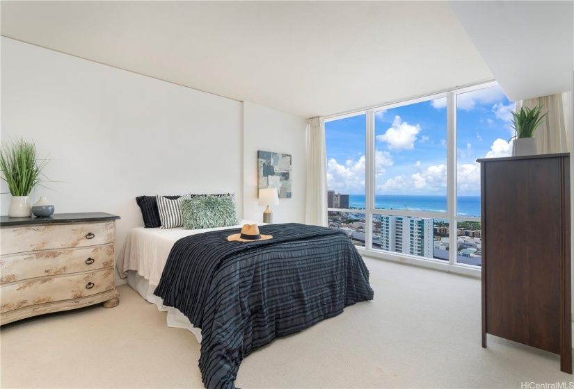 Primary bedroom with ocean views.