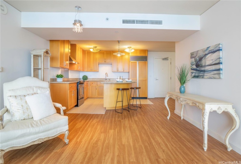 Open kitchen and the den is to the right of this photo near the entrance of the unit.