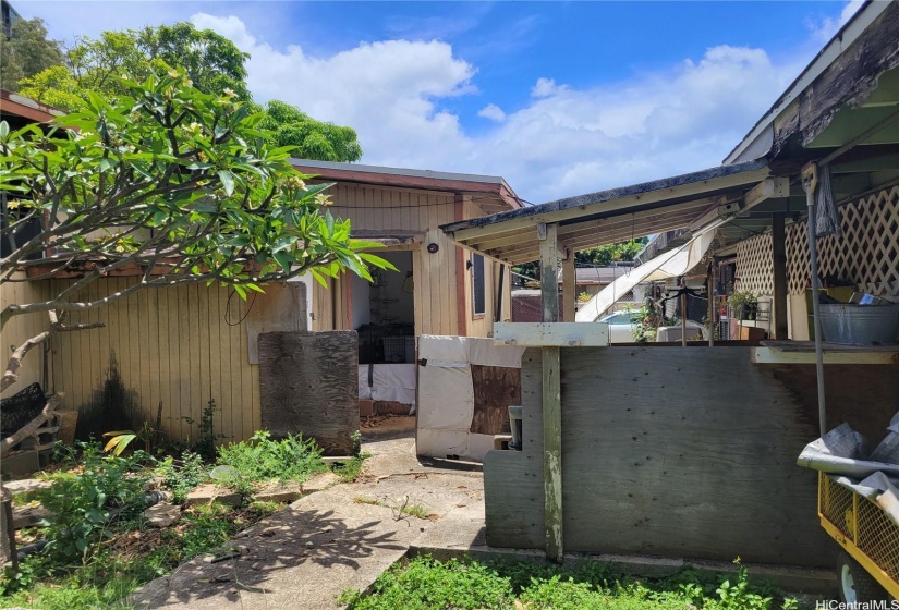 large carport on the right and front house on the left