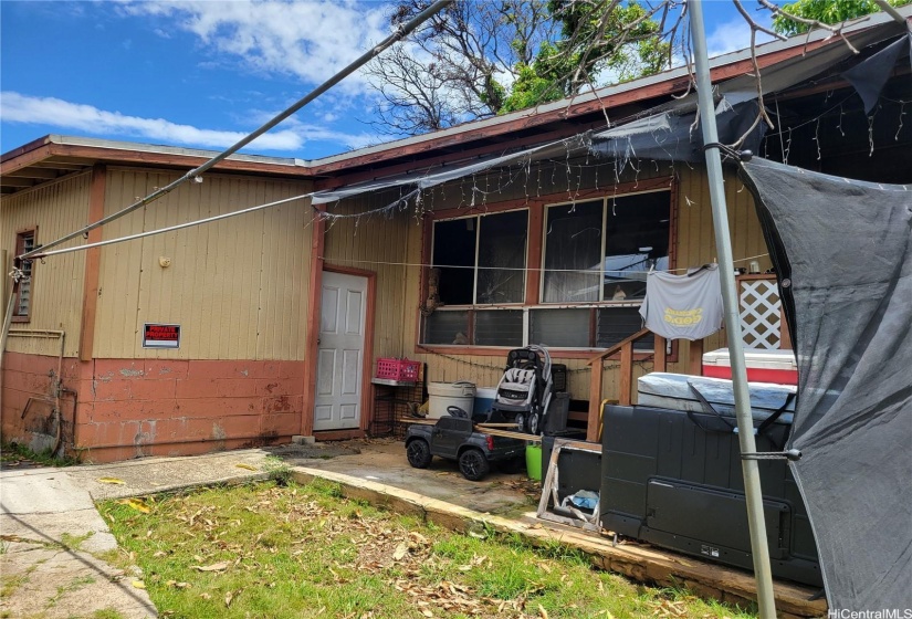 front house. White door has a shower and toilet.