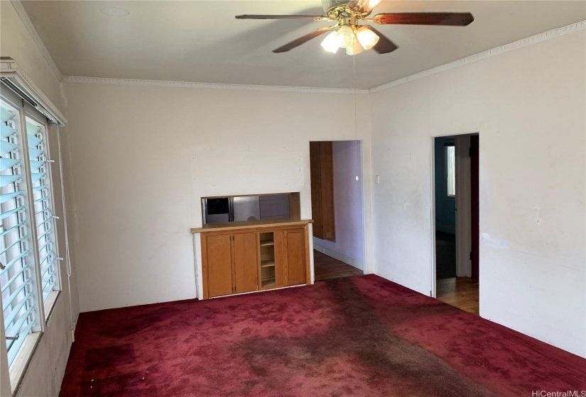 Unit 1 - Main House: Living Room with view to kitchen and hallway