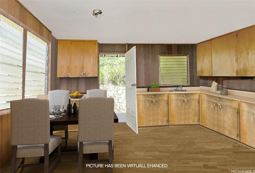 Dining area and kitchen virtual decluttered and staged.