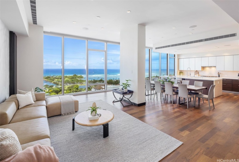 Expansive open floor plan linking the living area to the dining room and kitchen. 12 ft ceilings and floor to ceilings windows.