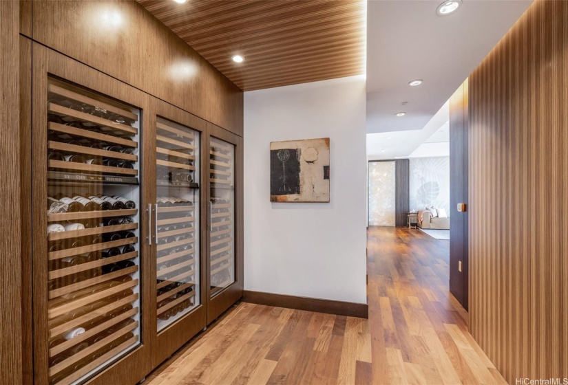 Stunning entryway complete with wine refrigerators.