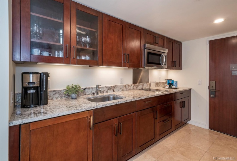 A view of kitchen.  Kitchen area is larger than other hotel condo nearby.