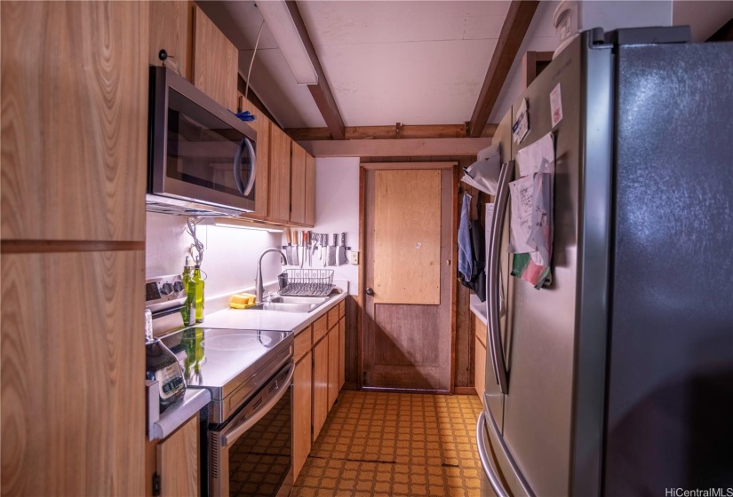 Galley kitchen from interior hallway