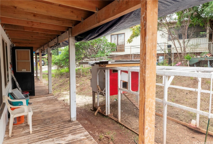 Back yard space with chicken coop (wild chickens do convey)