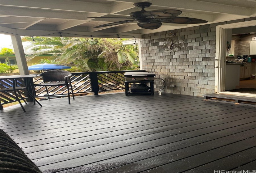 Spacious wrap around deck leads to this spacious covered area.