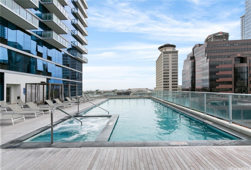 Pool, lounge chairs and cabanas.