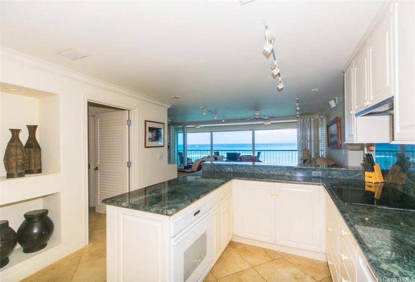 The open kitchen is perfect for preparing delicious meals while enjoying the ocean breeze.