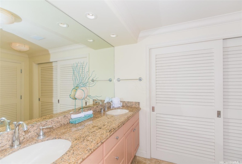 The additional bathroom has a beautiful double sink vanity in addition to two large closets.