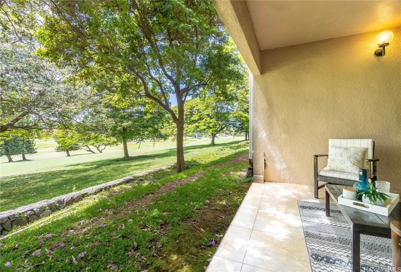 Tranquil covered lanai overlooking the 18th Fairway of Mid Pacific Golf Course.