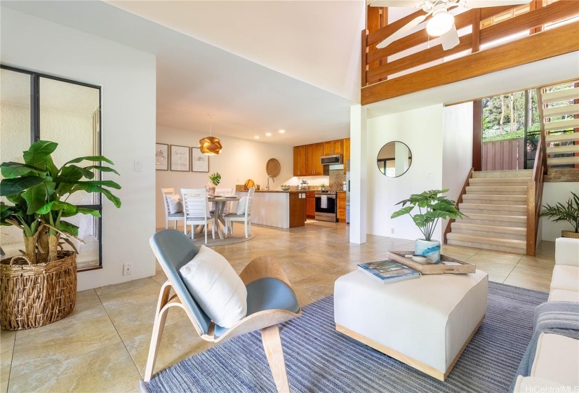 Beautiful open floorpan, including a loft style layout blending the ground floor with the primary bedroom staircase.