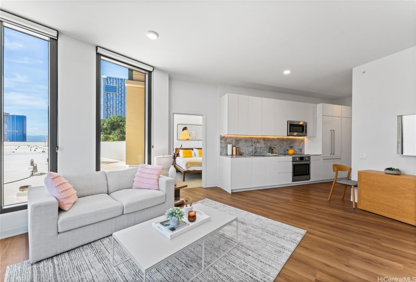 A modern wide spaced living room with the natural light from the outside that gives a vibrant aura on the living area.