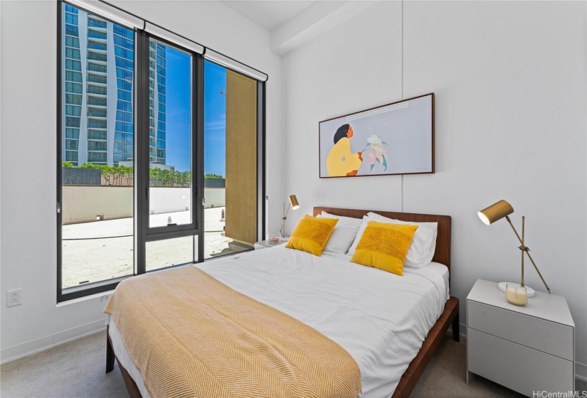 Bedroom 2 with high window giving the room its natural lighting