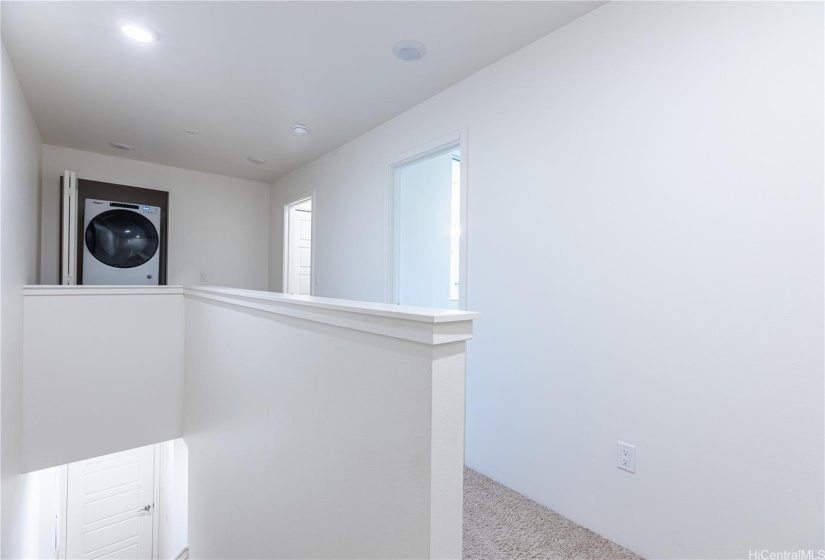 Stairs and Hallway on the 2nd level leading to the 2nd and 3rd Bedrooms + Bathrooms.