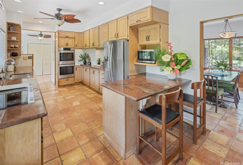 Darling kitchen with an exterior door for easy grocery transport from the garage.