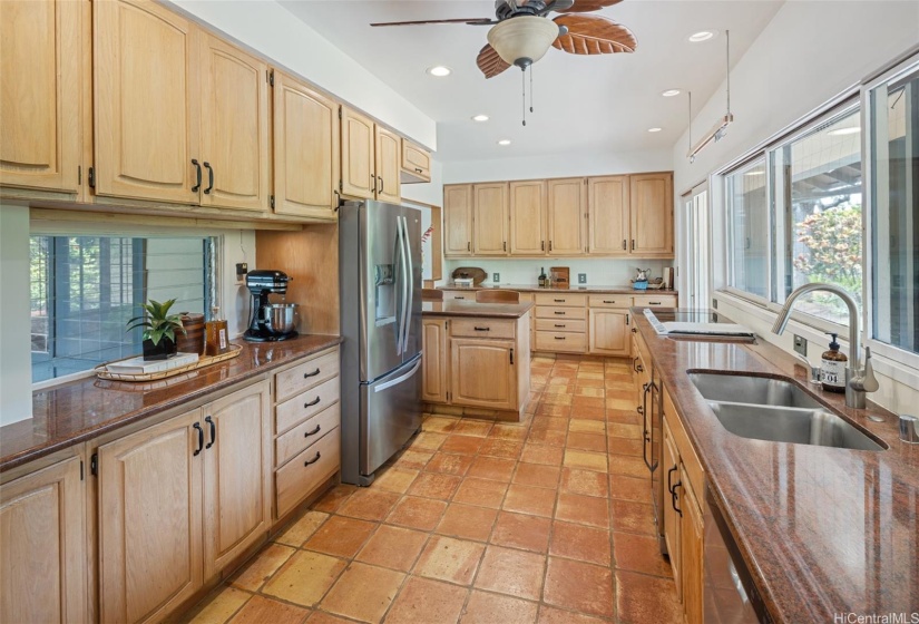 The Kitchen features a breakfast bar and is next to the laundry room and office space.