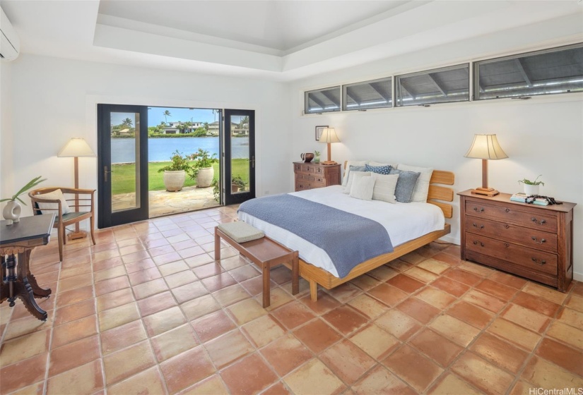 Primary bedroom with view of the water.