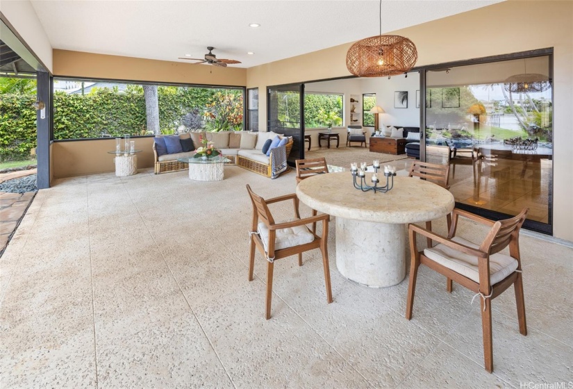 Dining and relaxation areas on the covered lanai.