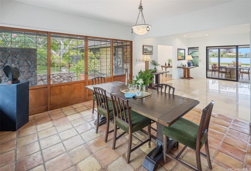 The dining room also features views of the water and pool area.