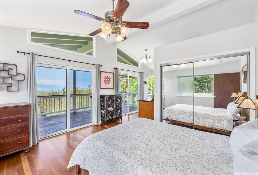 Primary bedroom with ocean views and large lanai