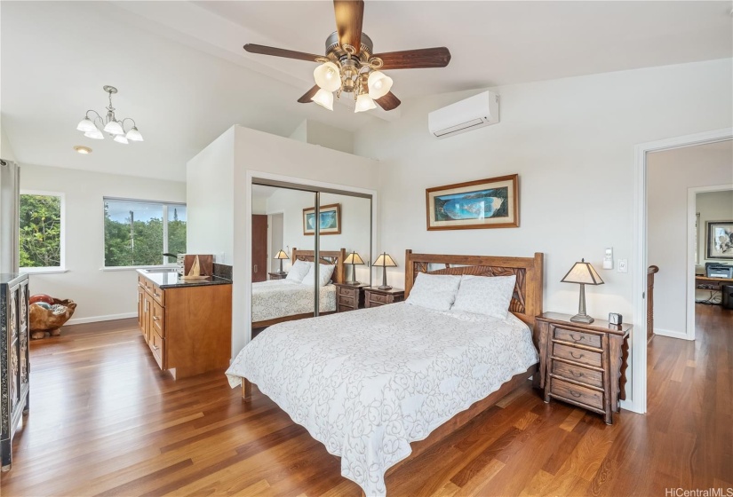 Primary bedroom with ocean and mountain views