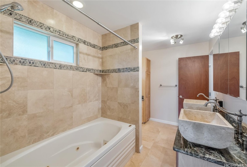 3rd full bathroom downstairs with tub/shower and double sink