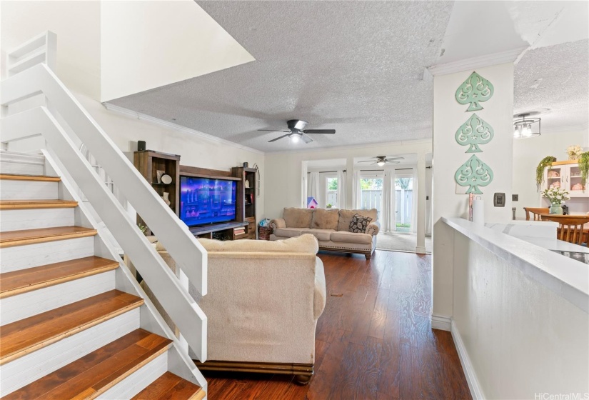 Entry way with first bedroom to the left, half bathroom and laundry to the right