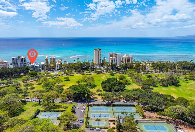 Across the street from Kapiolani park with public tennis courts, basketball and more.