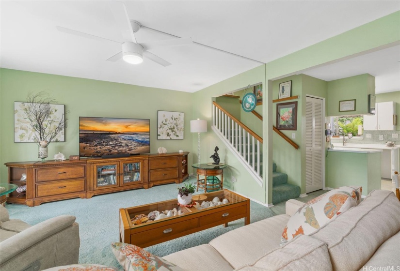 Spacious living room with newly replaced fans in all rooms