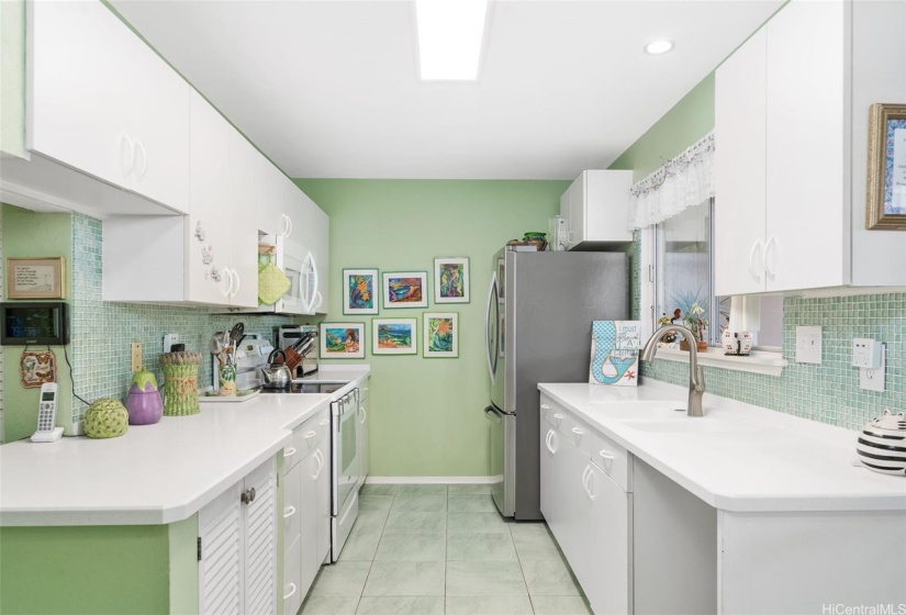 Galley kitchen with Corian countertops