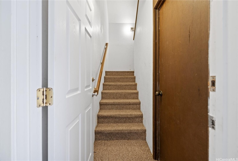 Stairway leading up to top-roof deck.