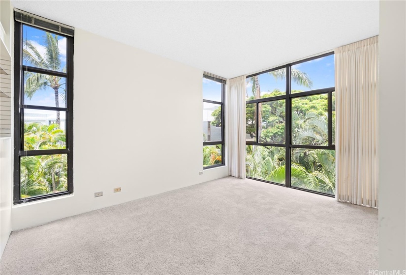 Primary bedroom has amazing open-concept windows with natural light flowing in !