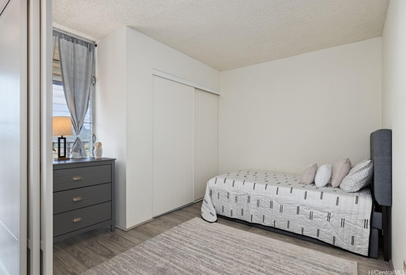 The second bedroom has folding screen doors.