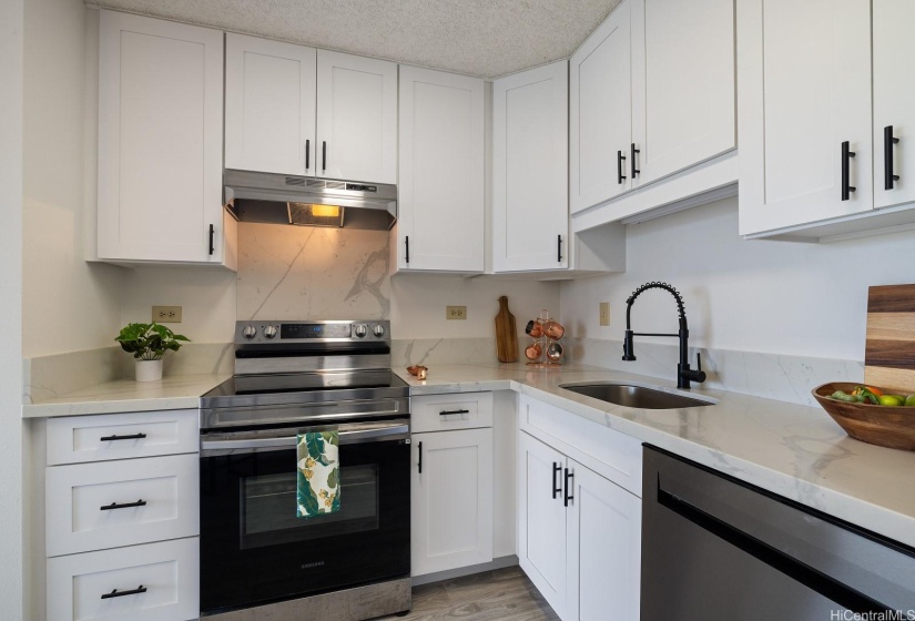 Featuring stainless steel appliances and Quartz countertops