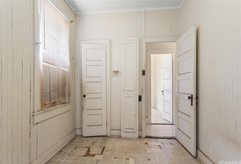 Back left side bedroom has an old fashioned built in ironing board.