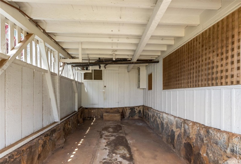 Carport has a door to the laundry area and an outside bathroom in the front.