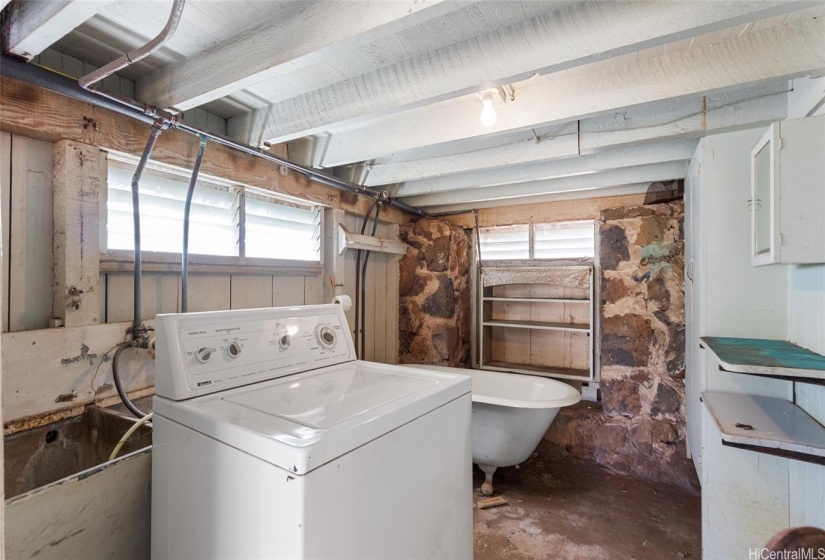 Laundry and bath area at the front of the carport has a very low ceiling