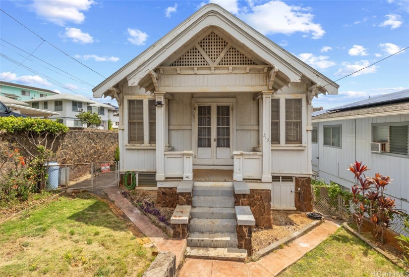 This classic 1929 vintage home awaits! Inviting front entrance with covered porch and original architectural details still intact.