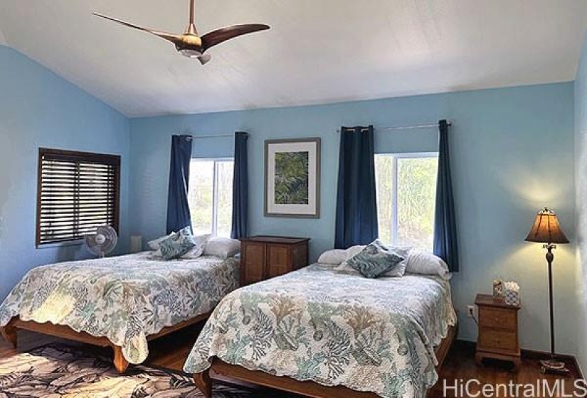 Primary bedroom with two beds, adjoining bathroom door and separate entrance from the front upstairs lanai, 15-857 Paradise Ala Kai Drive...