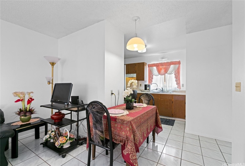 A glimpse of the fully equipped kitchen and dining table can be seen from here.