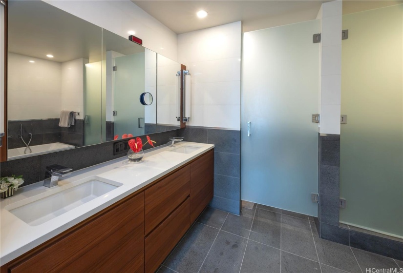 Primary bath. Double vanities, WC with glass door, shower room